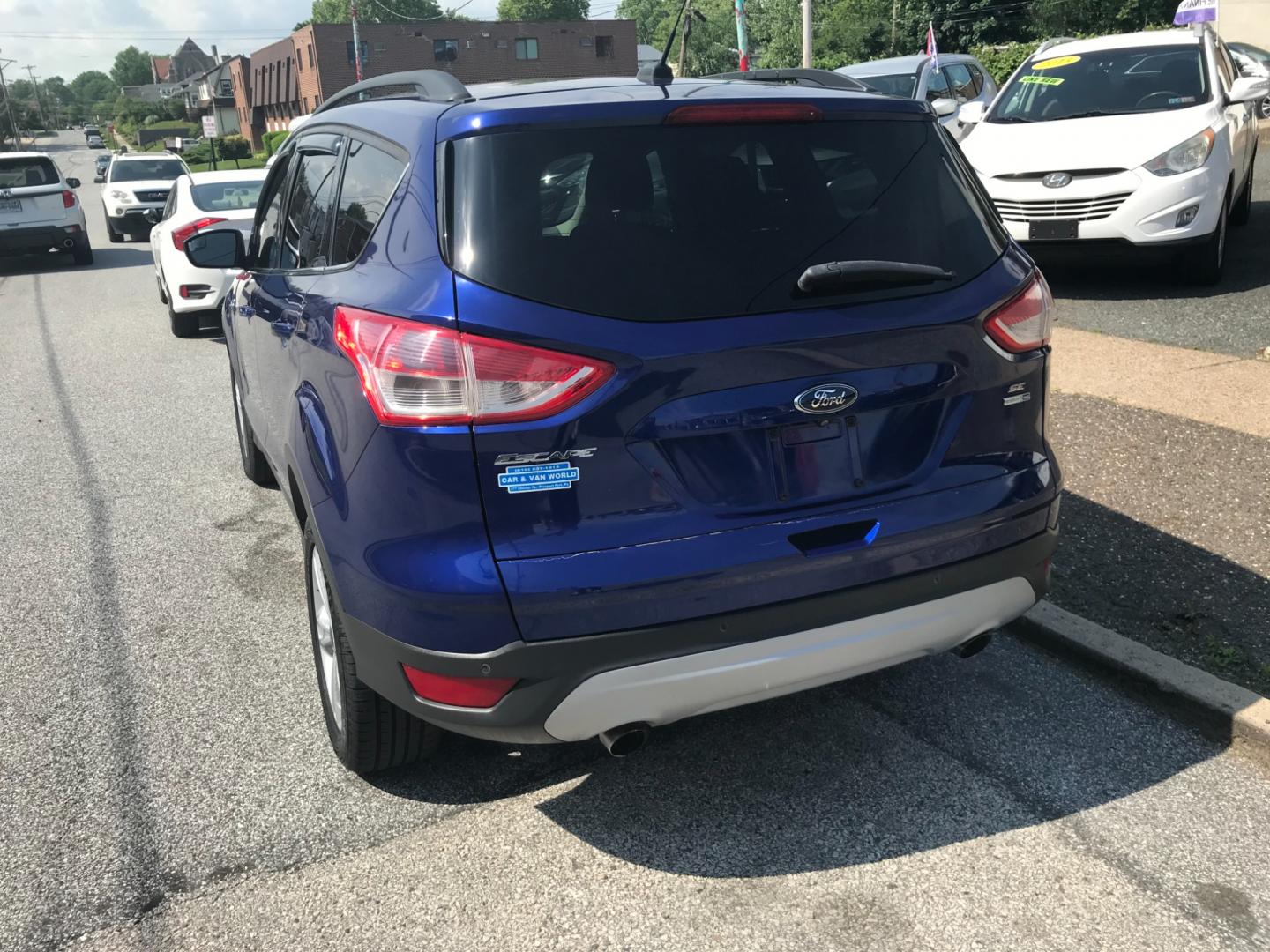 2014 Blue /Gray Ford Escape SE (1FMCU9GX8EU) with an 1.6 V4 engine, Automatic transmission, located at 577 Chester Pike, Prospect Park, PA, 19076, (610) 237-1015, 39.886154, -75.302338 - Photo#5